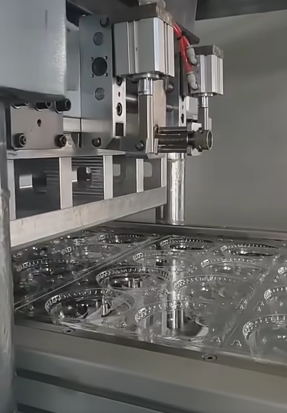 Testing dome lid mould on three station thermoforming machine model 650 450
